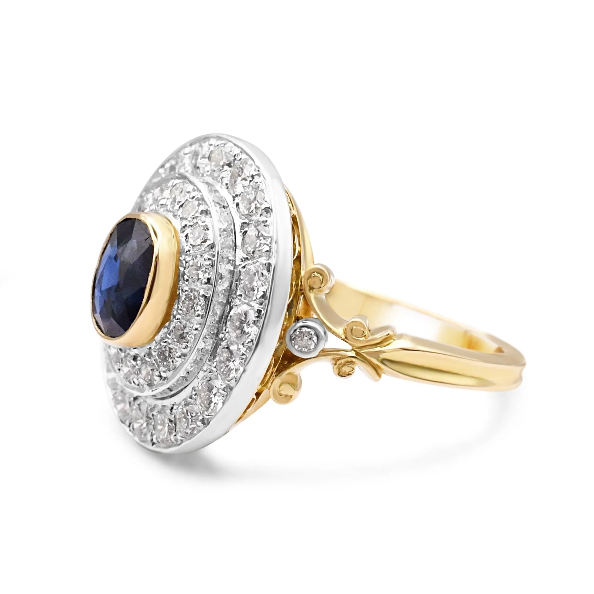 Oval Sapphire And Two Row Brilliant Cut Diamond Cluster Ring